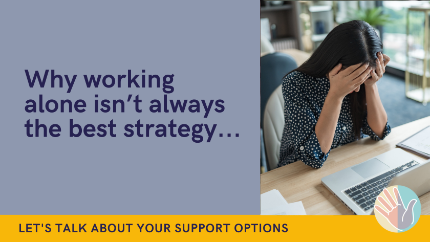 Lady with head in hands sat at laptop